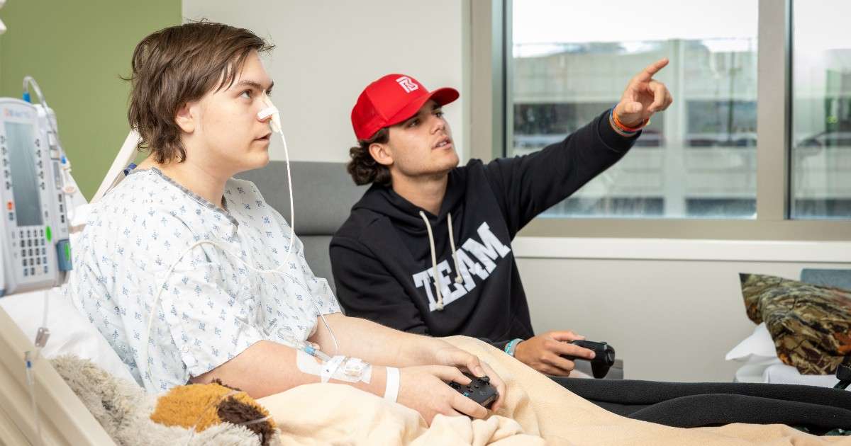 Rocco Becht at Mary Greeley Medical Center with a pediatric patient